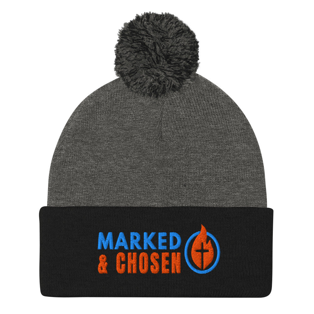 Black and Heather Grey Sportsman SP15 pom pom cuffed knit cap with Marked & Chosen Logo Embroidered on a white background.
