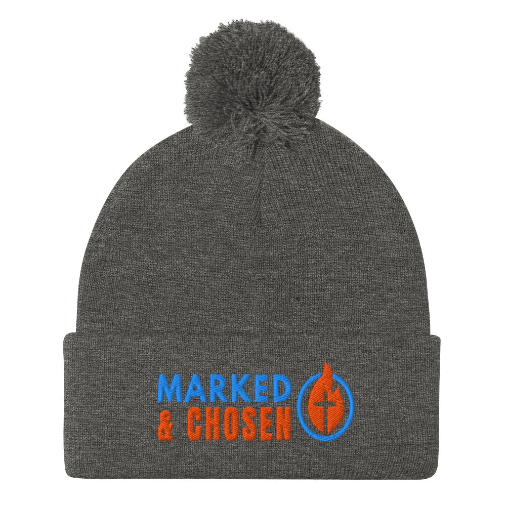 Dark Heather Grey Sportsman SP15 pom pom cuffed knit cap with Marked & Chosen Logo Embroidered on a white background.