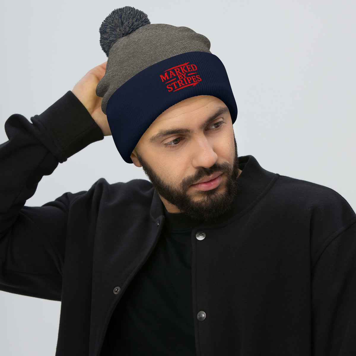 Marked by Stripes Pom-Pom Beanie - Dark Heather Grey/ Navy - Front View 2