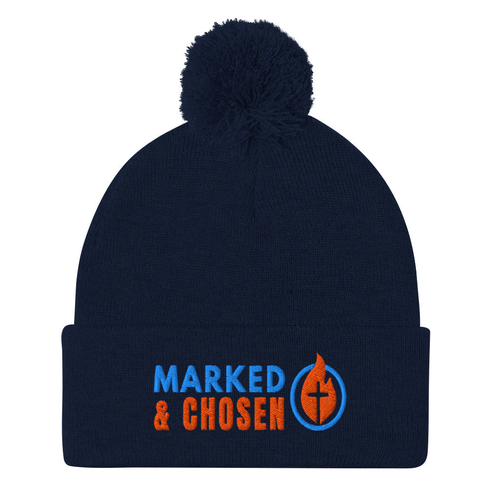 Navy Blue Sportsman SP15 pom pom cuffed knit cap with Marked & Chosen Logo Embroidered on a white background.