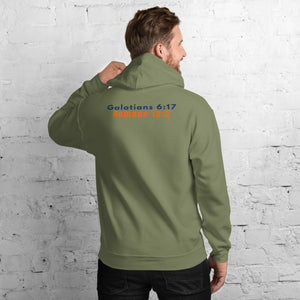 Back of Model wearing Gildan 18500 heavy blend hooded sweatshirt in Military Green, showing a classic fit and Printed on the back is the Marked & Chosen Verses: Galatians 6:17 and Romans 12:2.